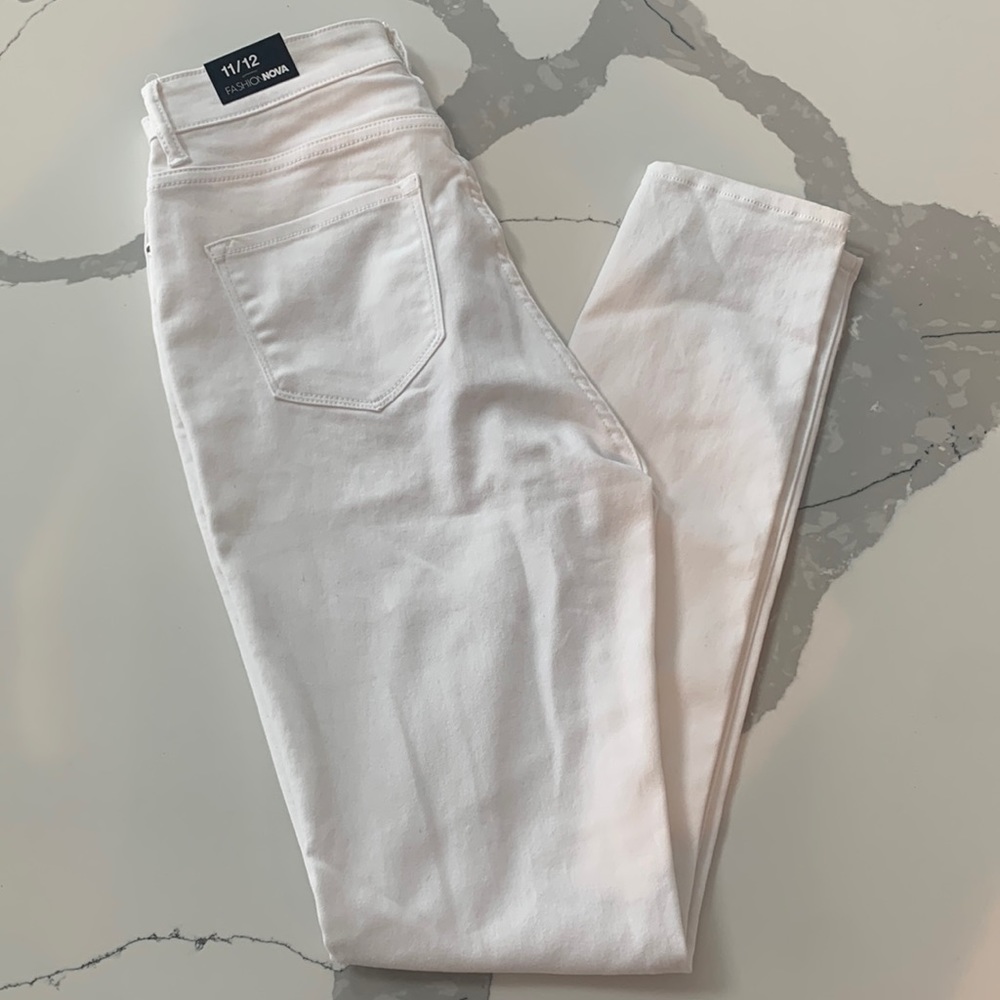 Brand new, crisp white skinny jeans. Very stretchy and tall friendly.